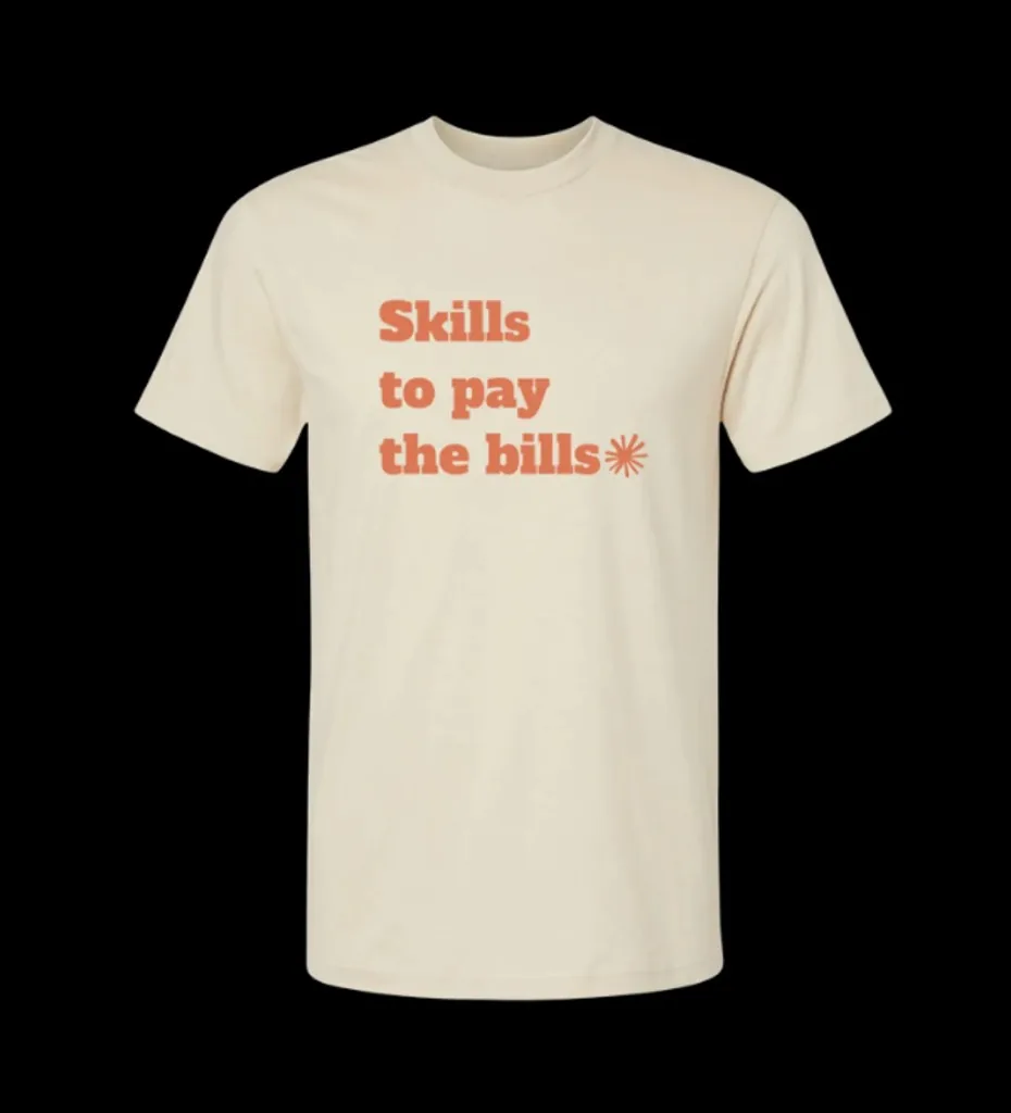 Cream t-shirt with terracotta Skills to pay the bills design